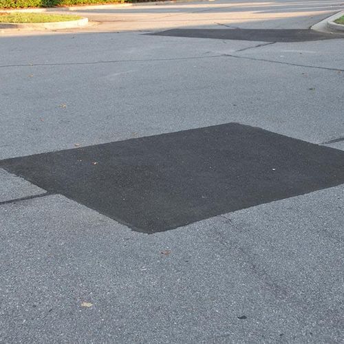 Got holes? We can fix that! We saw cut old asphalt