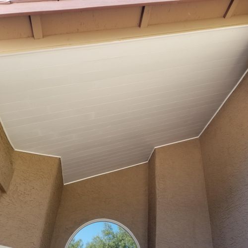 Shiplap exterior ceiling with a large quarter roun