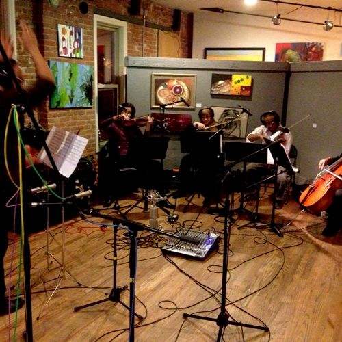 Conducting a string quartet recording session for 