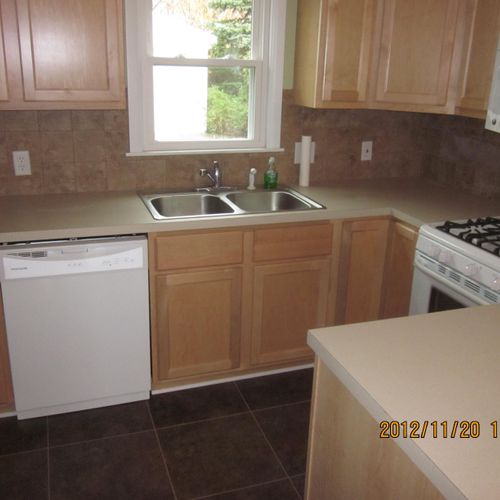 Kitchen cabinet install with laminate counter and 