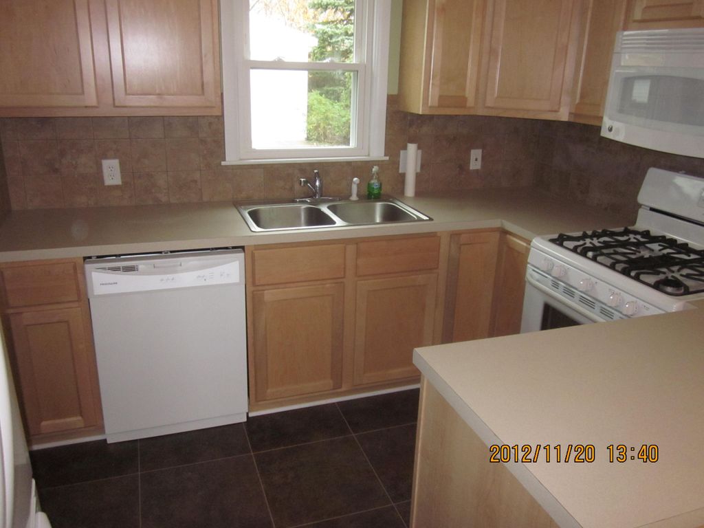 Kitchen cabinet install with laminate counter and 