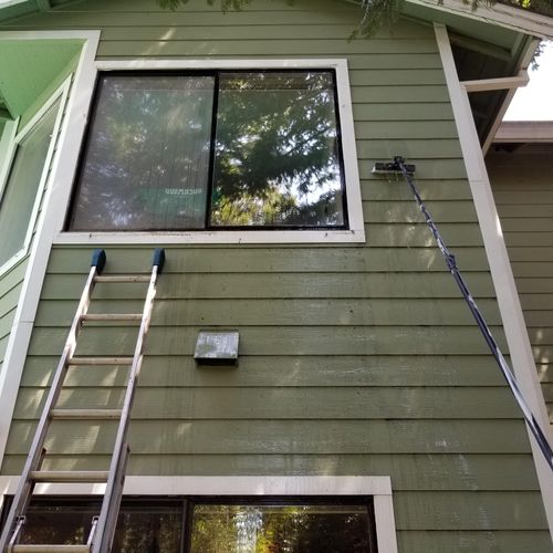 Washing windows with a water fed pole in Fair Oaks
