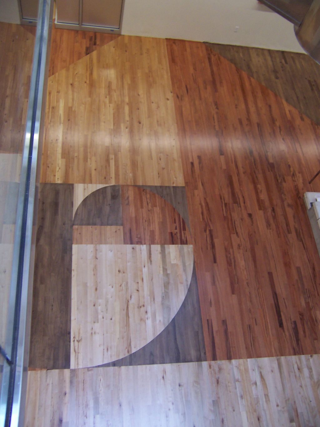 Reclaimed flooring in nautilus pattern at Westmins