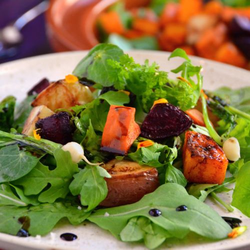 Roasted root vegetables salad with balsamic reduct