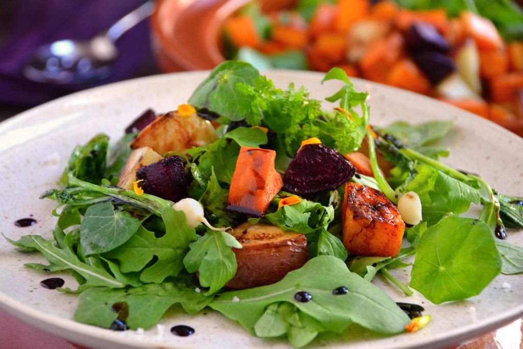 Roasted root vegetables salad with balsamic reduct