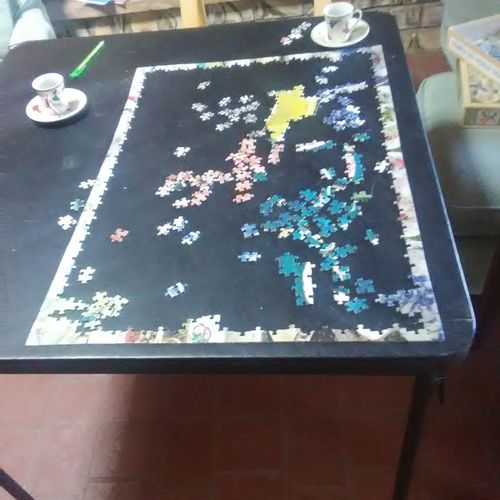 Doing jigsaw puzzle and having tea