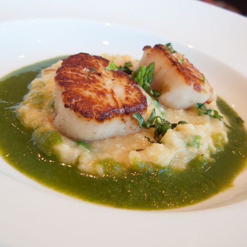 Seared Scallops over Seafood risotto with a Basil,