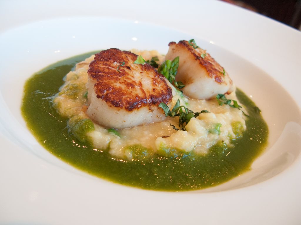 Seared Scallops over Seafood risotto with a Basil,