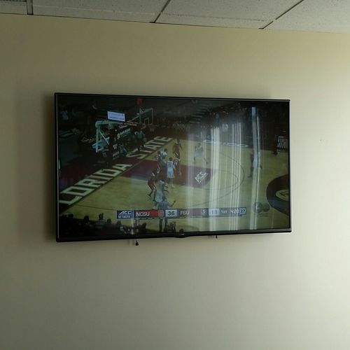 Conference Room T.V. mounted on wall.