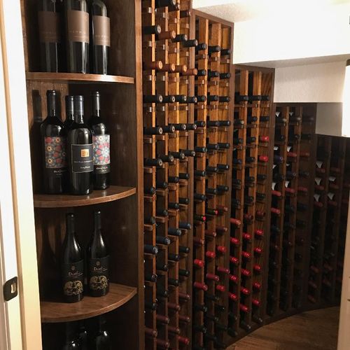 Wine cabinet under curved staircase