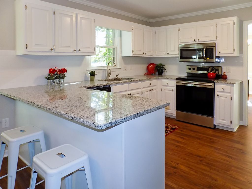 This is the kitchen and bar in a house that a frie