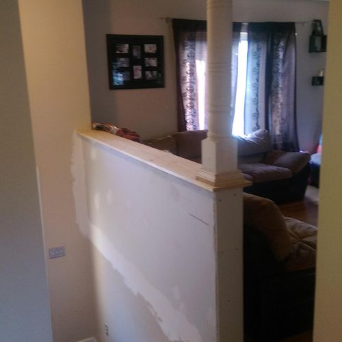 Removed banister added half wall