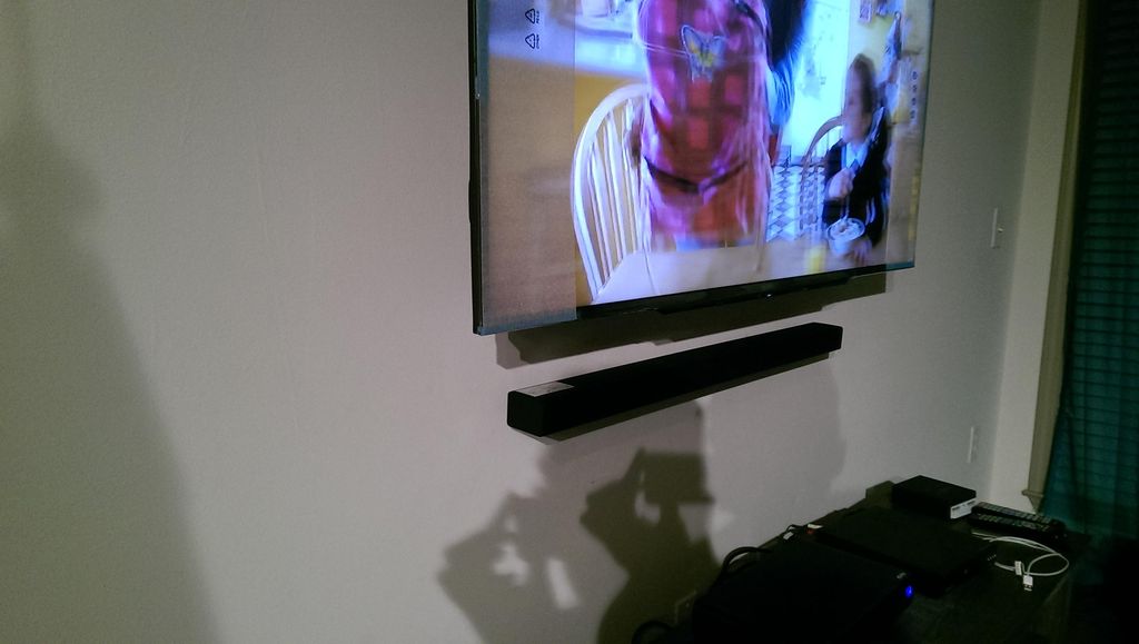 Mounted 55" TV and Sound Bar 