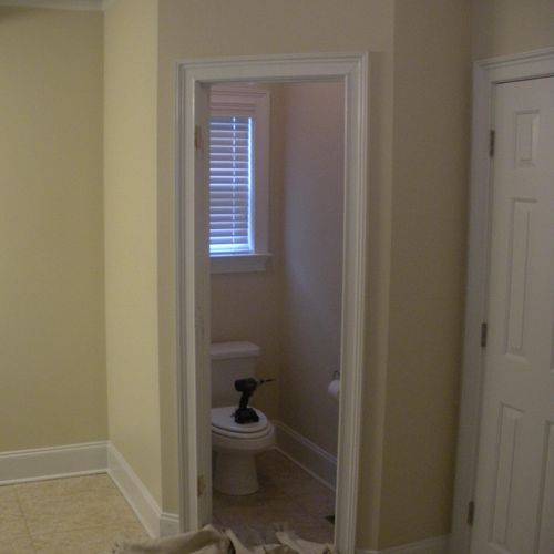 The doorway into the water closet is to narrow for