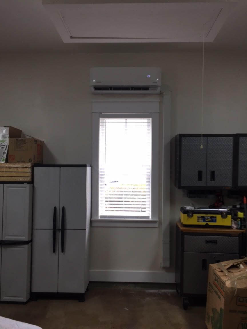 Ductless unit installed in garage (above window)