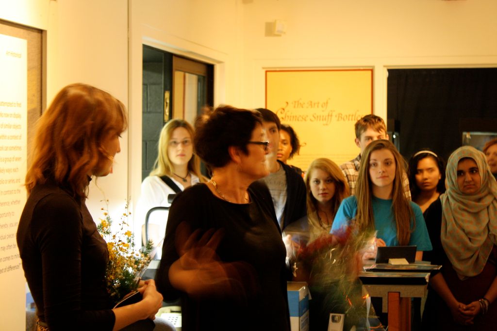 This photo features event attendees listening to a