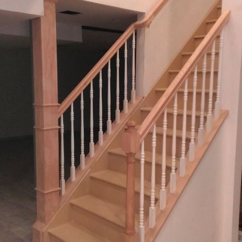 Completed staircase and rail in Finished Basement