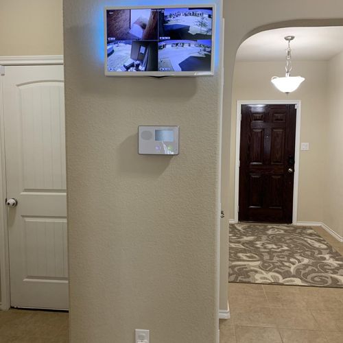 Camera system ran from nvr to mounted tv in entry 