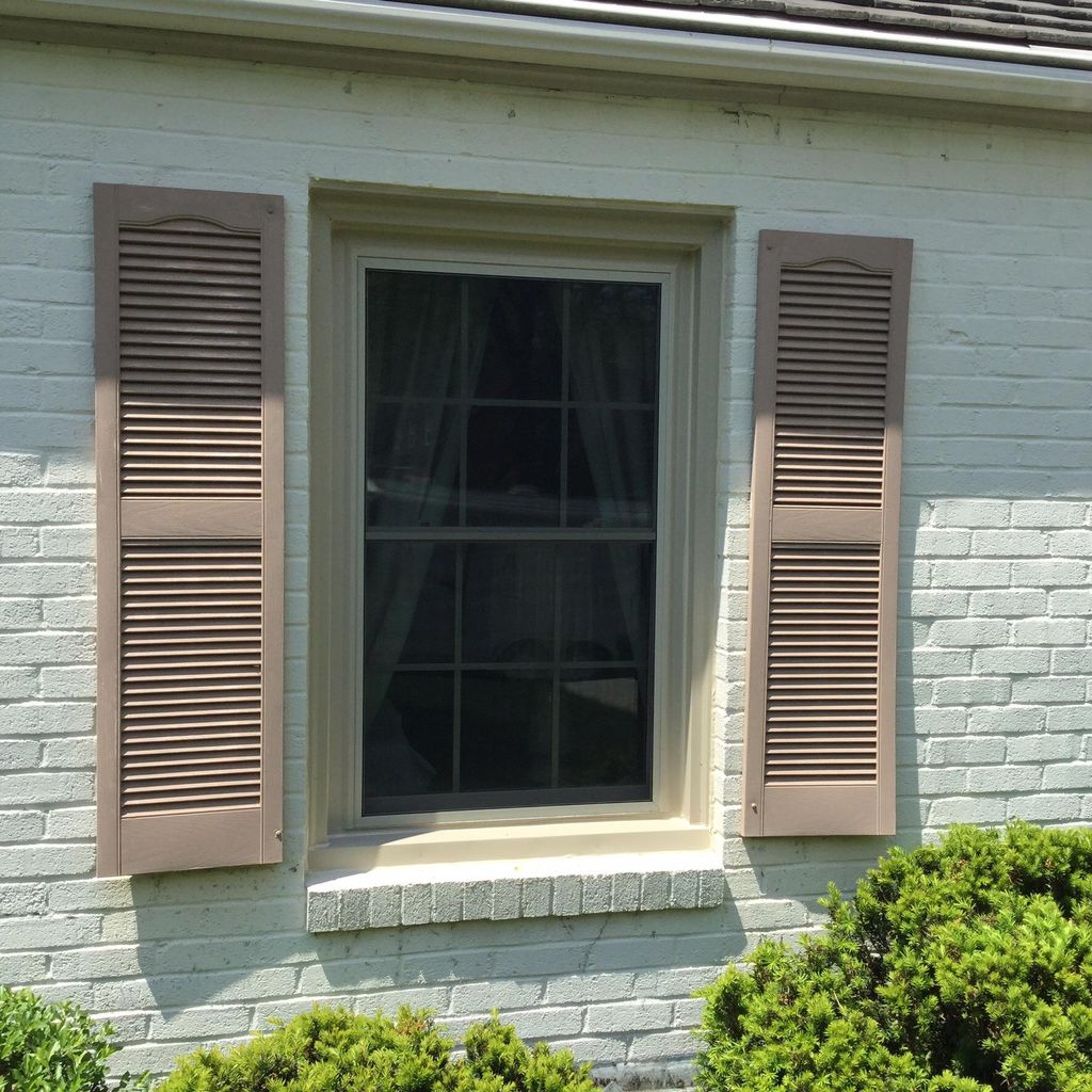 Atrium vinyl window with custom aluminum capping