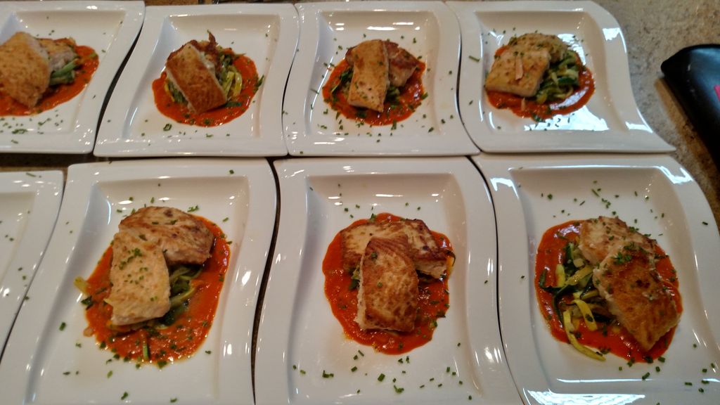 Marinated and sauteed salmon filet over herb saute