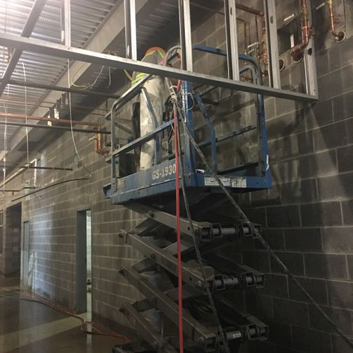 cutting out holes for  duct work for local HVAC Co