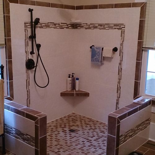 Large open custom tile shower with no curtain or d