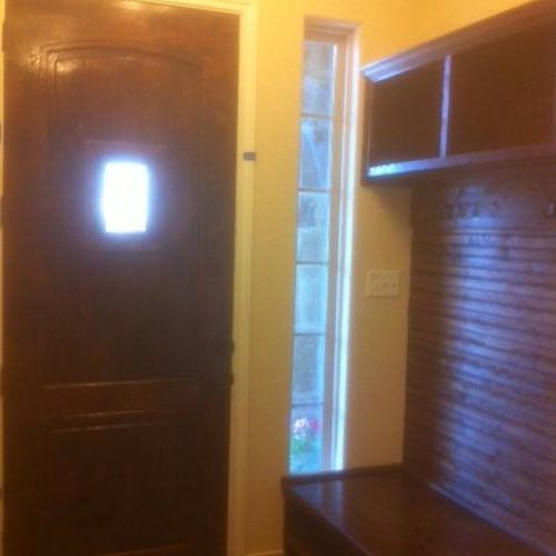 Built-in mud room. Bench with 8 cubbies for shoes,