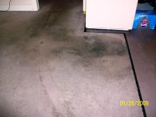 Heavily soiled carpet in kitchen. Owner thought it
