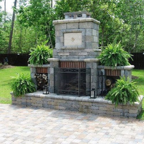 OUTDOOR FIRE PLACE INSTALLED WITH PAVER PATIO.