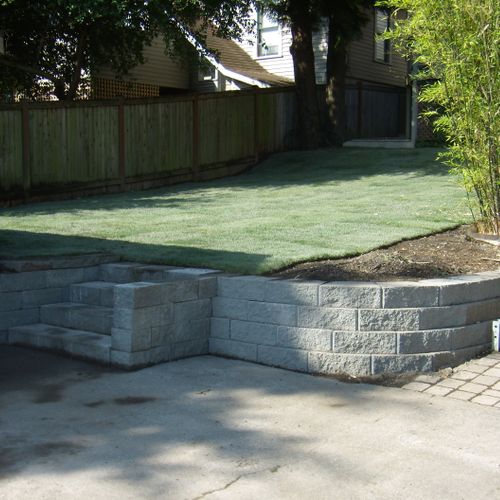 Sod and retaining wall installation