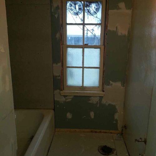 Before:Gutted Bathroom