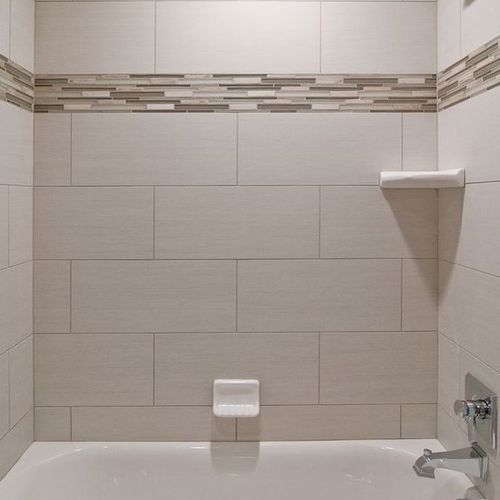 12x24 tile with mosaic in the middle for shower su
