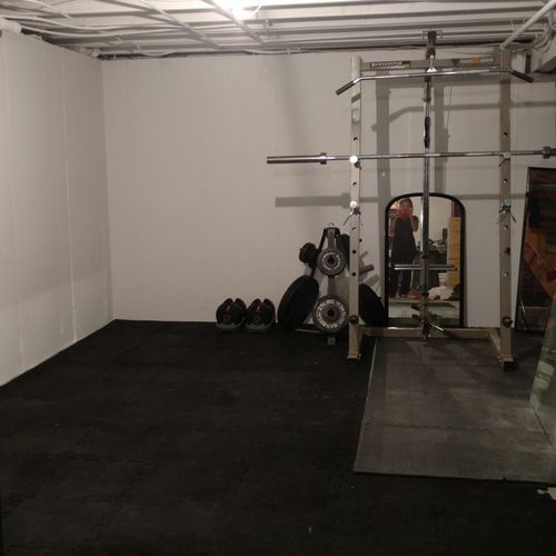 Private gym space including pull up bar, cable mac