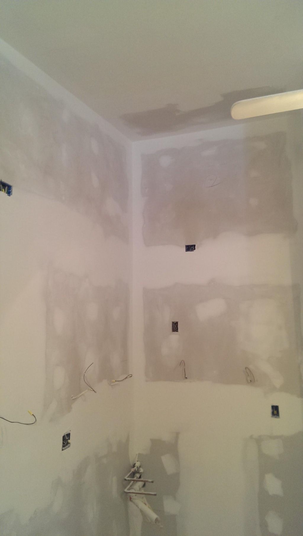 Completed Drywall area in a kitchen area.