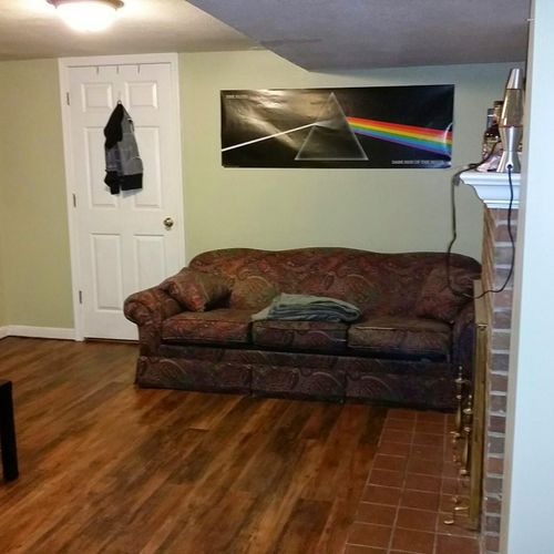 Painted walls and installed vinyl flooring