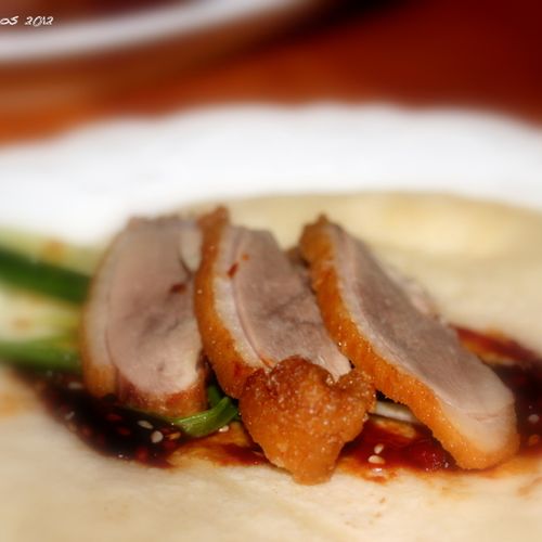 Roasted duck breasts with a Mandarin pancake