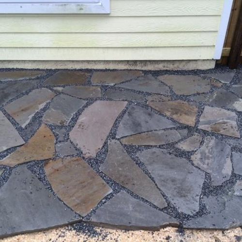 A close up view of a natural stone patio.  Our cli