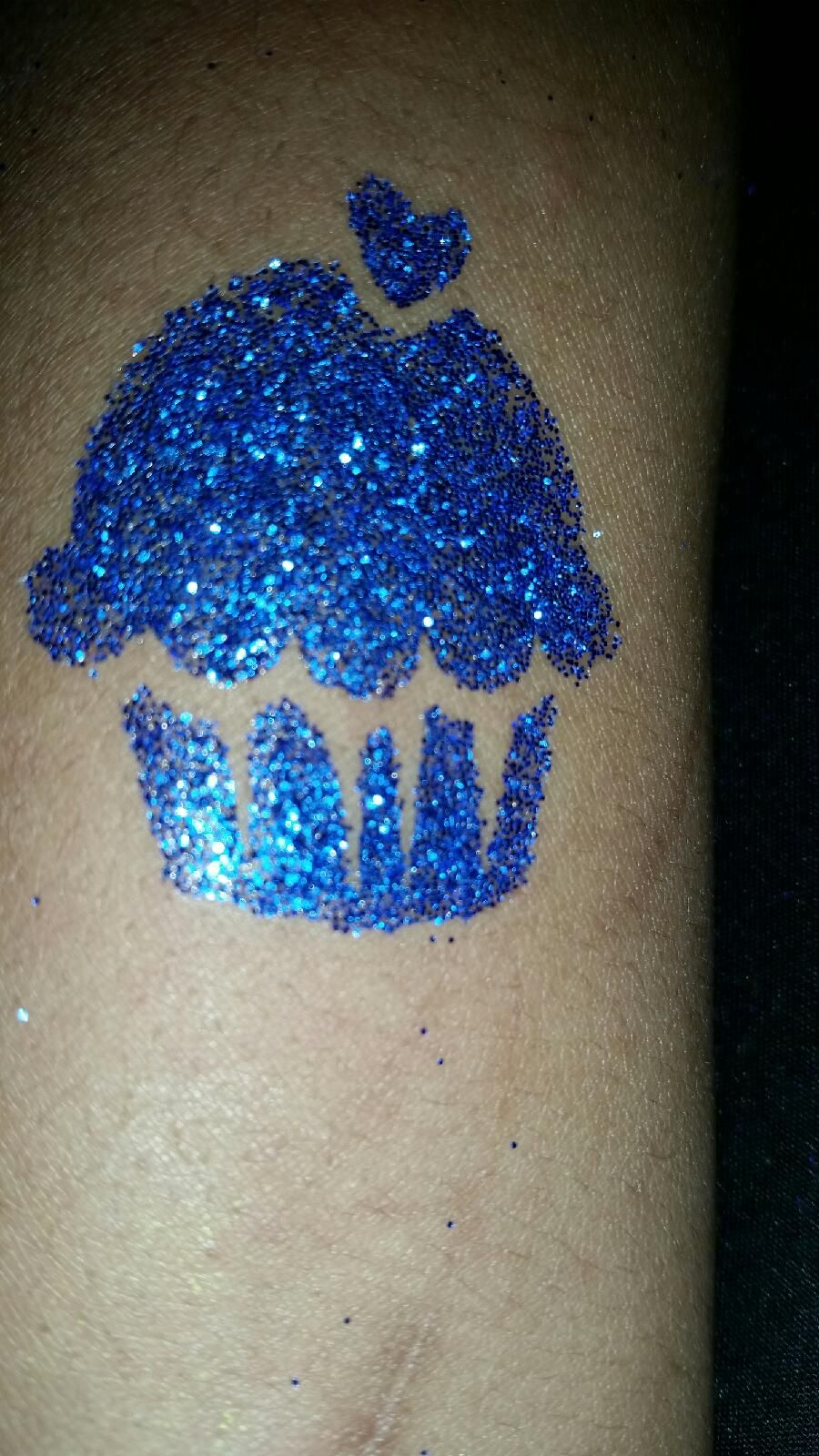 Glitter tattoo of cupcake