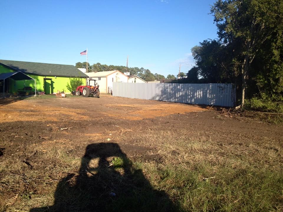 Brush Clearing, dirt work and new metal fence.