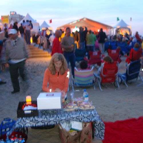 Setting up birthday celebration on the beach with 