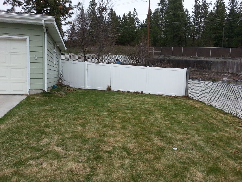 We replaced the existing wood fence with a new whi