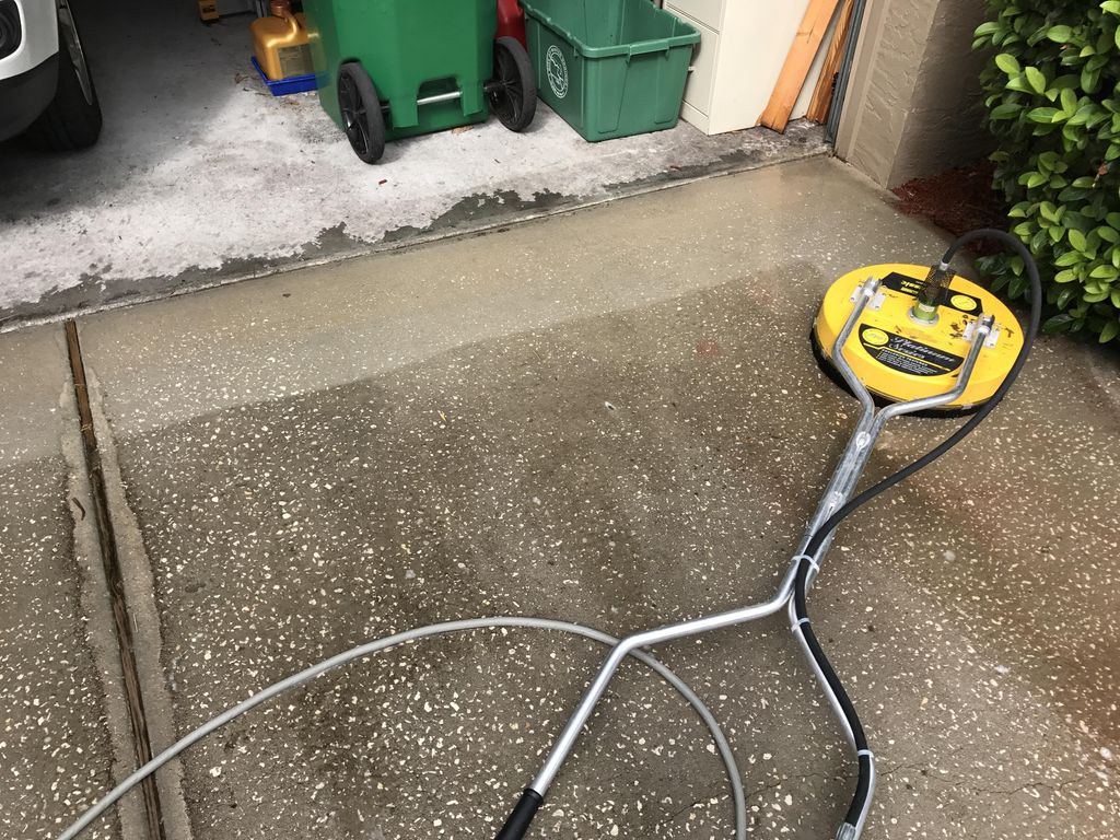 Driveway power washing with hot water 