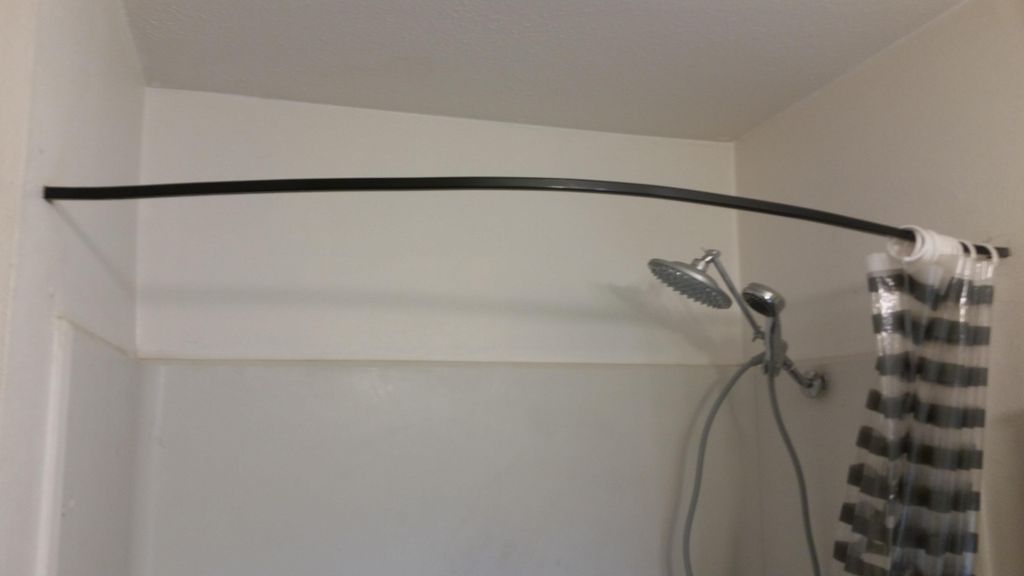 Floating extended shower rod for more room and loo