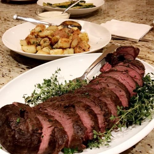 Slow roasted beef tenderloin with garlic roasted p