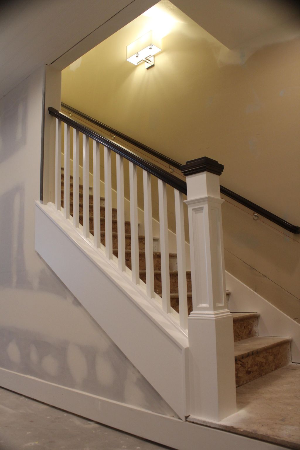Custom staircase and railing paint and stain.