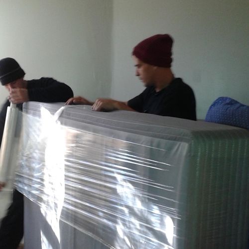 Shrink wrapping a mattress & box spring before loa