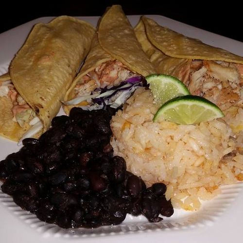 fish tacos wit black beans and Spanish rice.