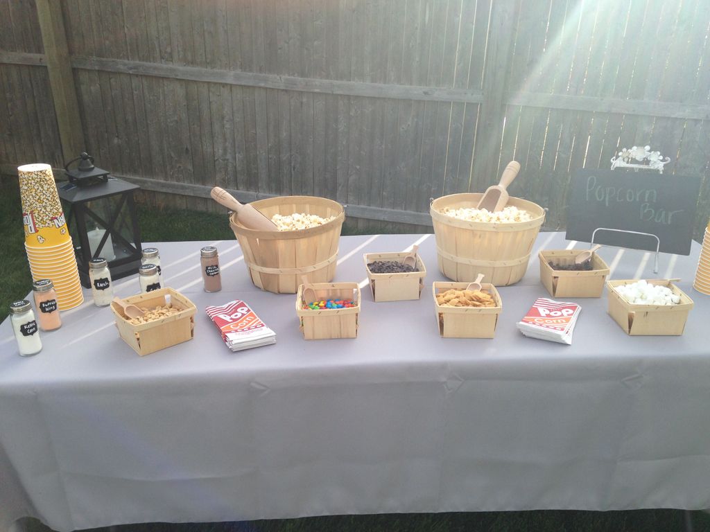 Popcorn table with a plethora of toppings to pleas