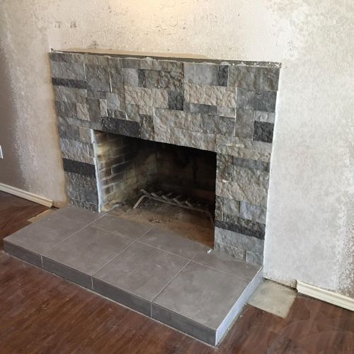 Photo during fireplace remodel.