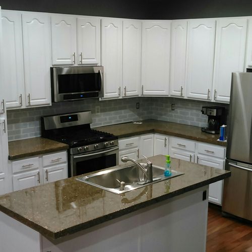 Custom concrete countertops, painted cabinets, new